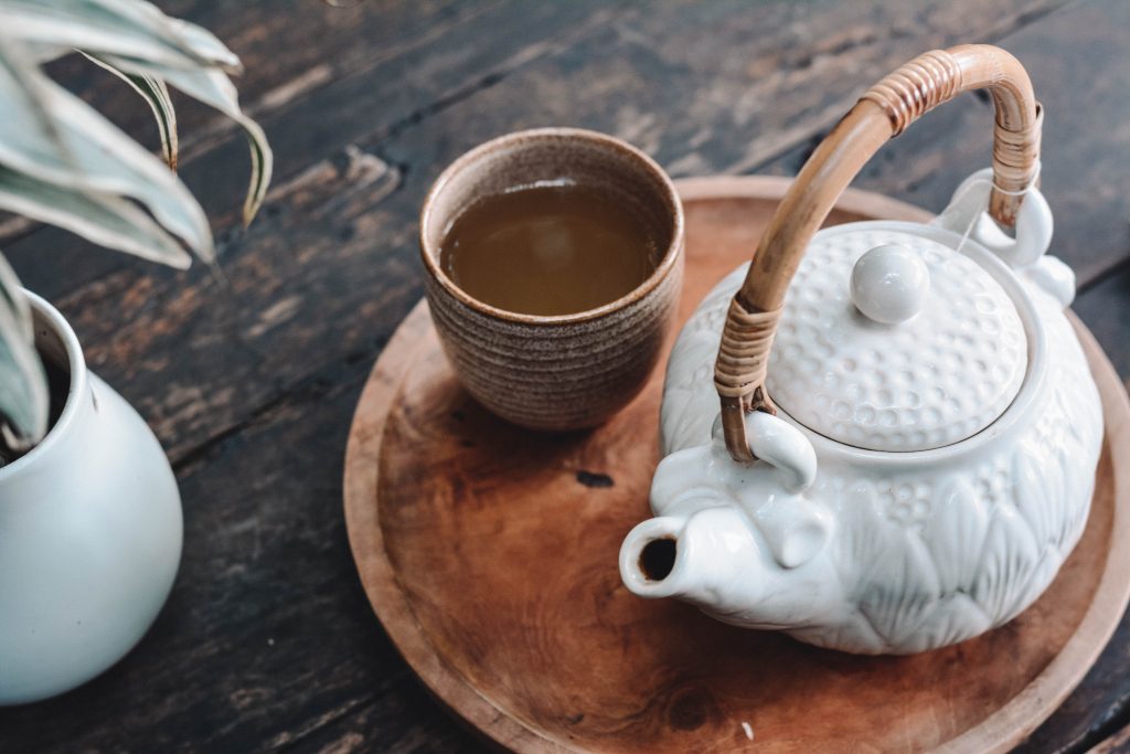 Teapot and a cup of black tea